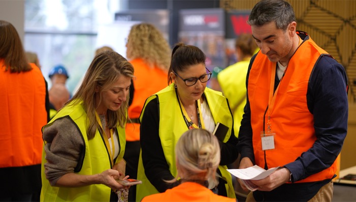 A team huddled together during Built to Win