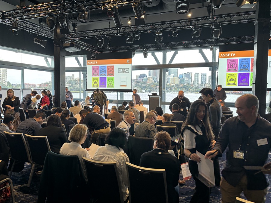 A full conference room running the Lion Cage simulation